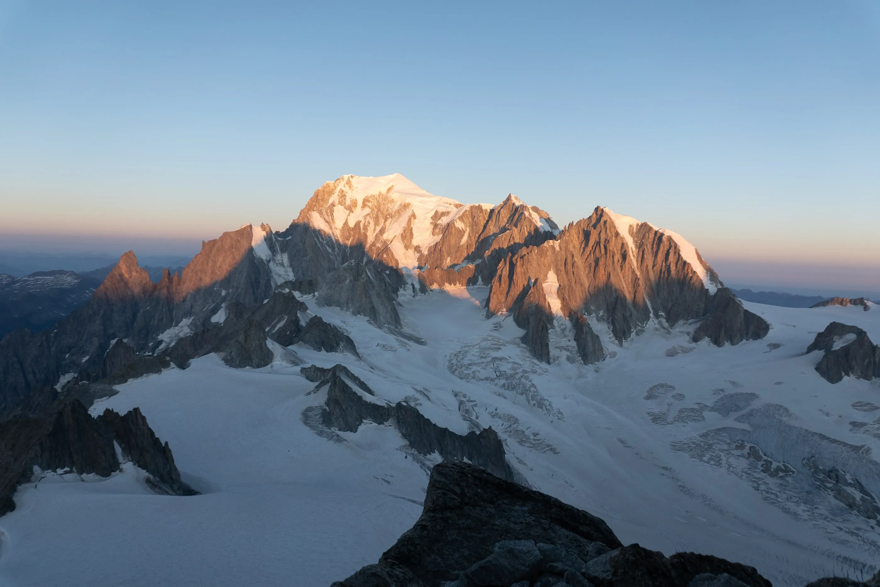 Early light on the snow and rock of the Mont Blanc massif, seen from high on the Glacier du Géant.